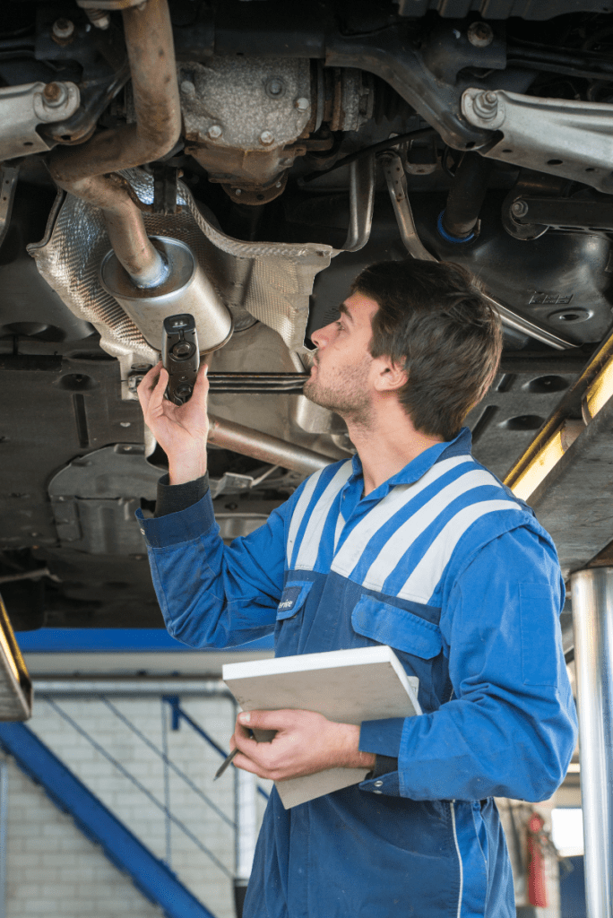 Mechanic inspecting underneath a vehicle - MOT, Servicing, Repairs & Commercial Vehicle Services Kent